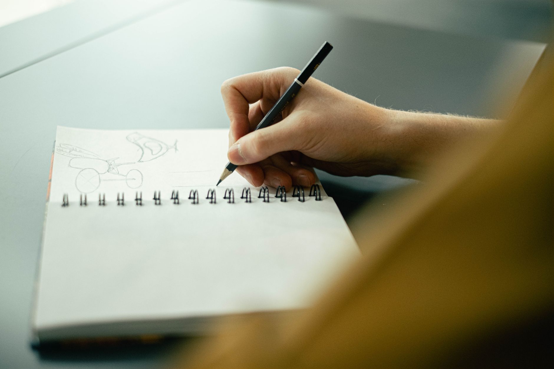 Hand sketching in a notebook
